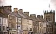 Barnard Castle market town view of shop fronts down street