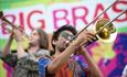 2 people playing brass instruments