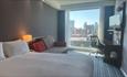 Inside a double room, with a city view