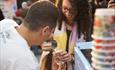 Person pouring a coffee at Manchester Coffee Festival
