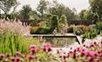 Family overlooking a small pond at RHHS Garden Bridgewater