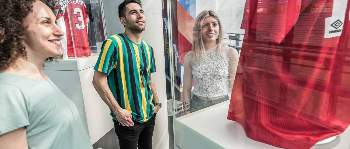 People in an exhibition in the National Football Museum