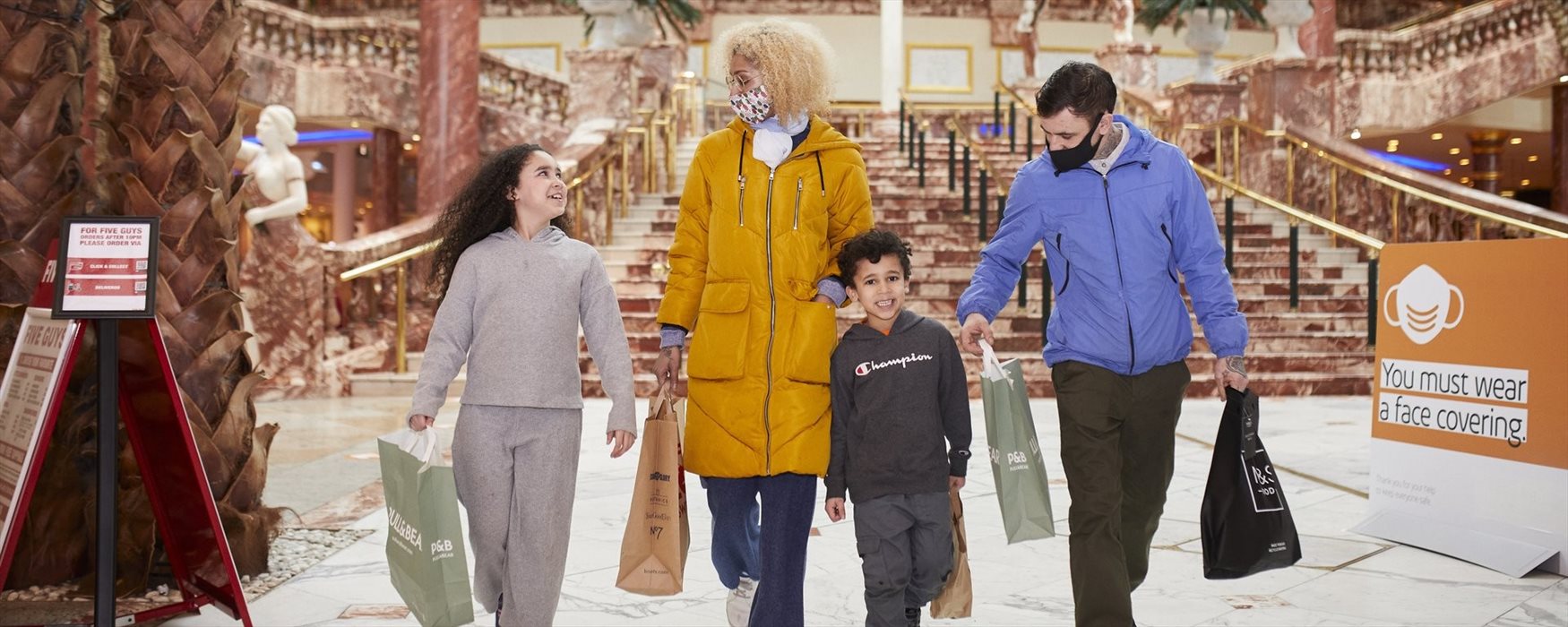 Family shopping at Trafford Centre, Manchester