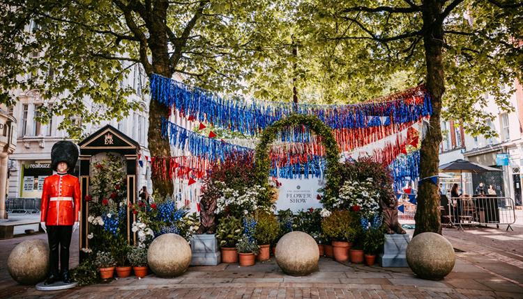 Floral garden with red white and blue bunting