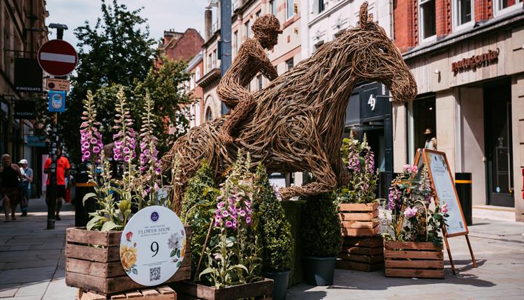 Horse and rider sculpture made of willow