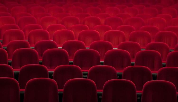 Empty red seats in a theatre