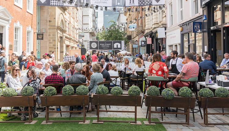 People dining outside on King Street, Manchester
