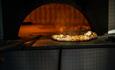 Pizza in a pizza oven