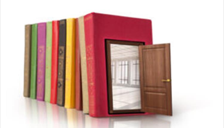 a row of books with a doorway through them