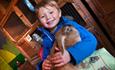 Cuddling a rabbit at Hall Hill Farm