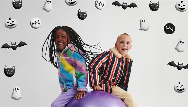 Kids on a purple bouncy ball