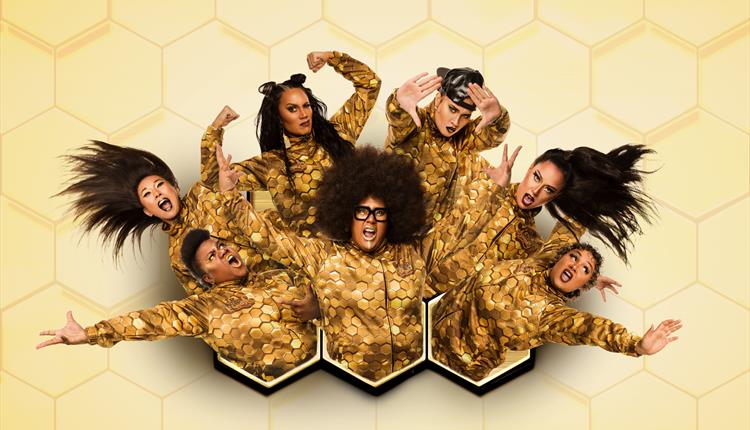 Hot Brown Honey cast in gold costumes