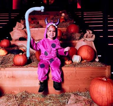 Child wearing a monster costume