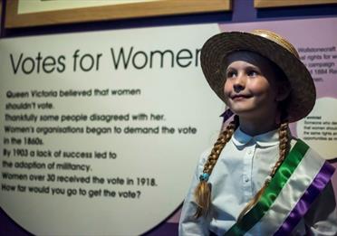 Girl dressed as a little suffragette