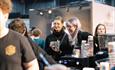 People enjoying coffee at Manchester Coffee Festival
