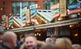 Chalet themed stalls in the Winter Wonderland in Piccadilly Gardens, part of Manchester Christmas Markets 2021