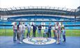 Group of fans inside the Etihad Stadium on a tour