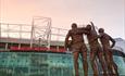 Statue outside of Manchester United Museum and Stadium Tour