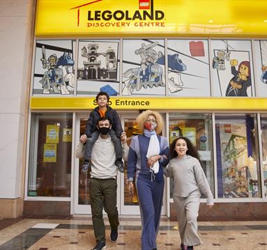 Family outside Legoland Discovery Centre