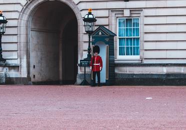 Royal Guard Standing Beside Building
