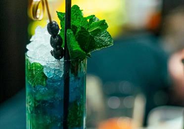 Freshly-prepared drink with ice and mint