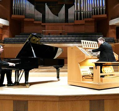 Two pianos on a stage