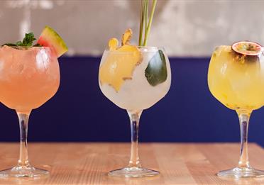 3 colourful fruit cocktail drinkls