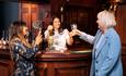 Coronation Street Experience women cheersing and drinking in the Rover's Return pub