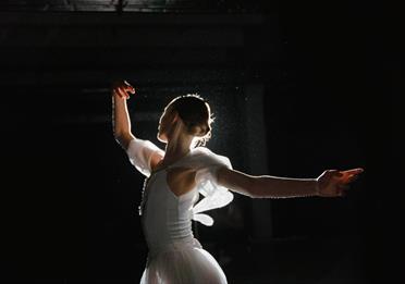 Woman in White Dress Dancing
