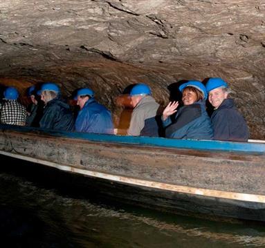 Boating along underground in Speedwell Cavern