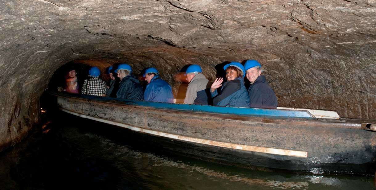Boating along underground in Speedwell Cavern