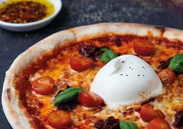 Pizza with burrata at Vapiano Manchester