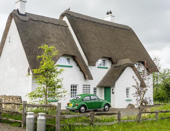 Outside view of Guest House with green car outside