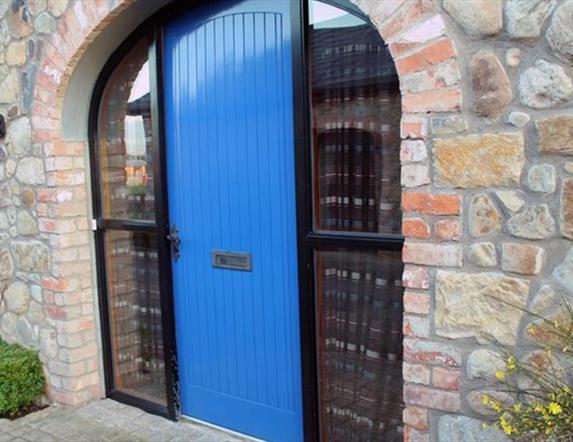 A bright blue door in an archway