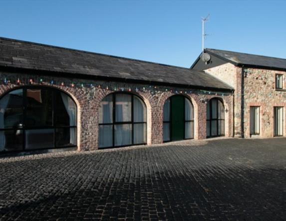 image of the arched windows in a long building