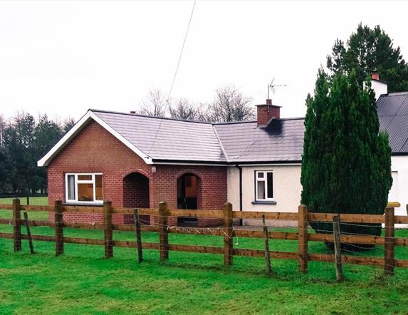 Outside image of house with wooden fence