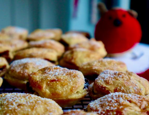 Image of homemade mine pies with a teddy robin in the background