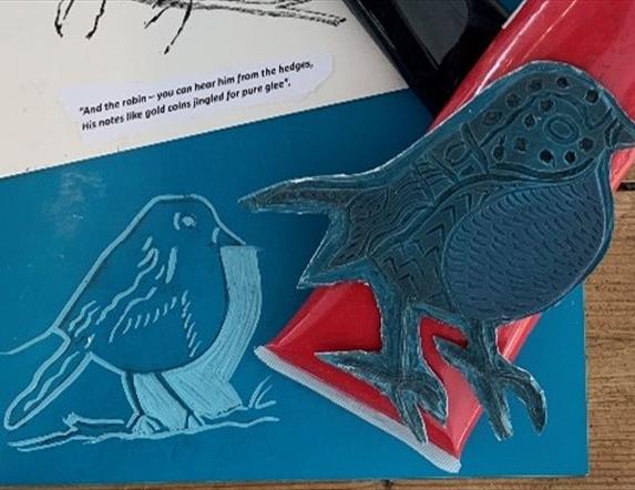 Image of a robin cut into lino
