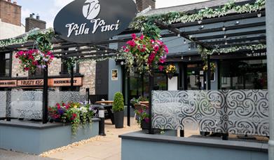 Restaurant with pergola and patio seating out front