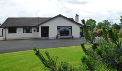 Outside view of house and garden 