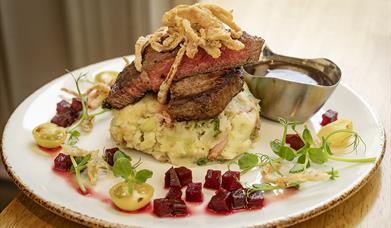 plate of steak and champ