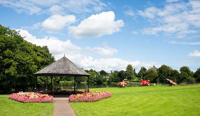 Dungannon park in the summer with floral displays by the lake