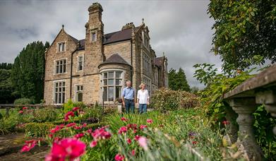 A mature couple in the garden of Blessingbourne House and estate.