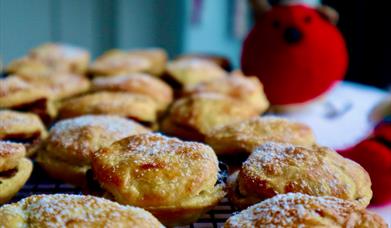 Image of homemade mine pies with a teddy robin in the background