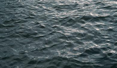 Image showing body of water with dark grey/blue ripples