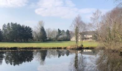 Image of the golf course over the lake