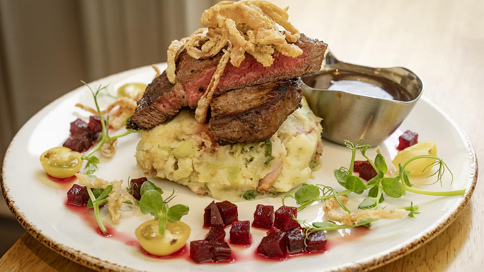 plate of steak and champ