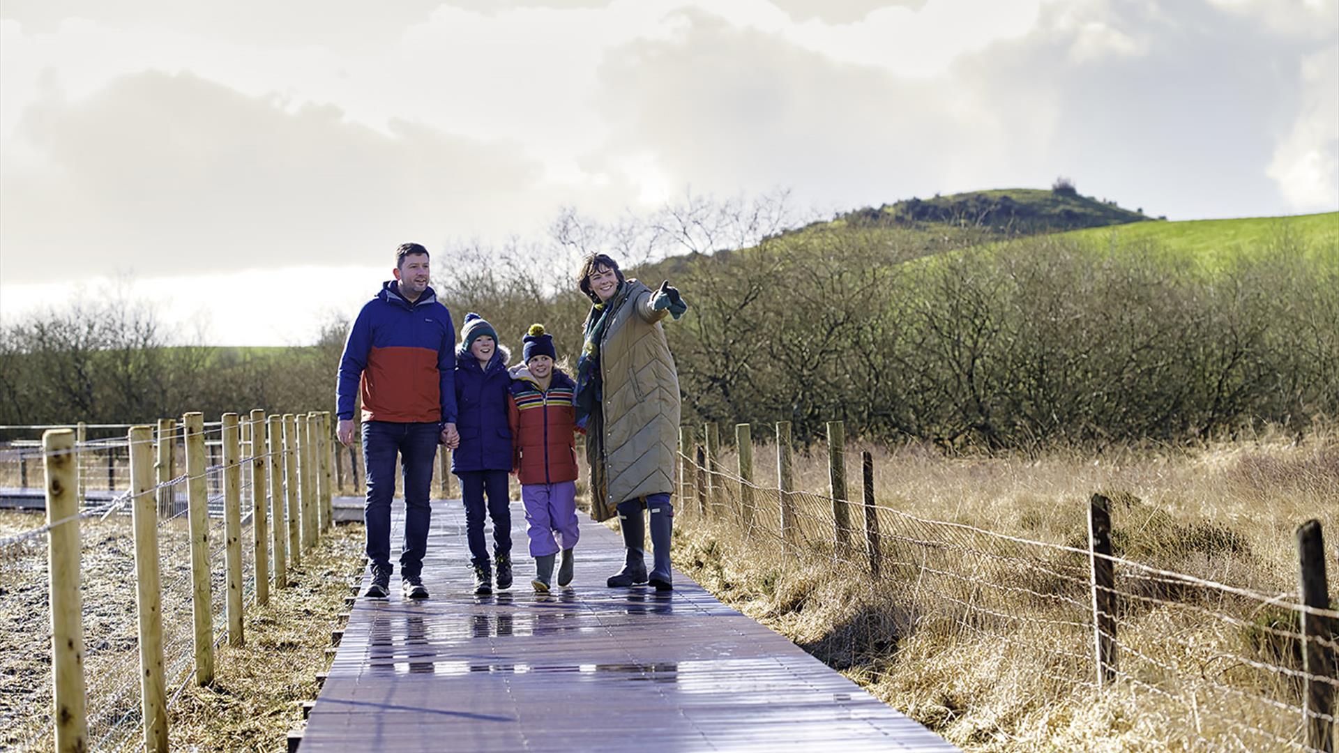 Family walking on boardwalk