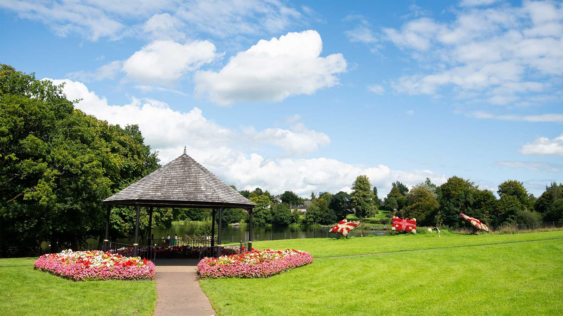 Dungannon park in the summer with floral displays by the lake