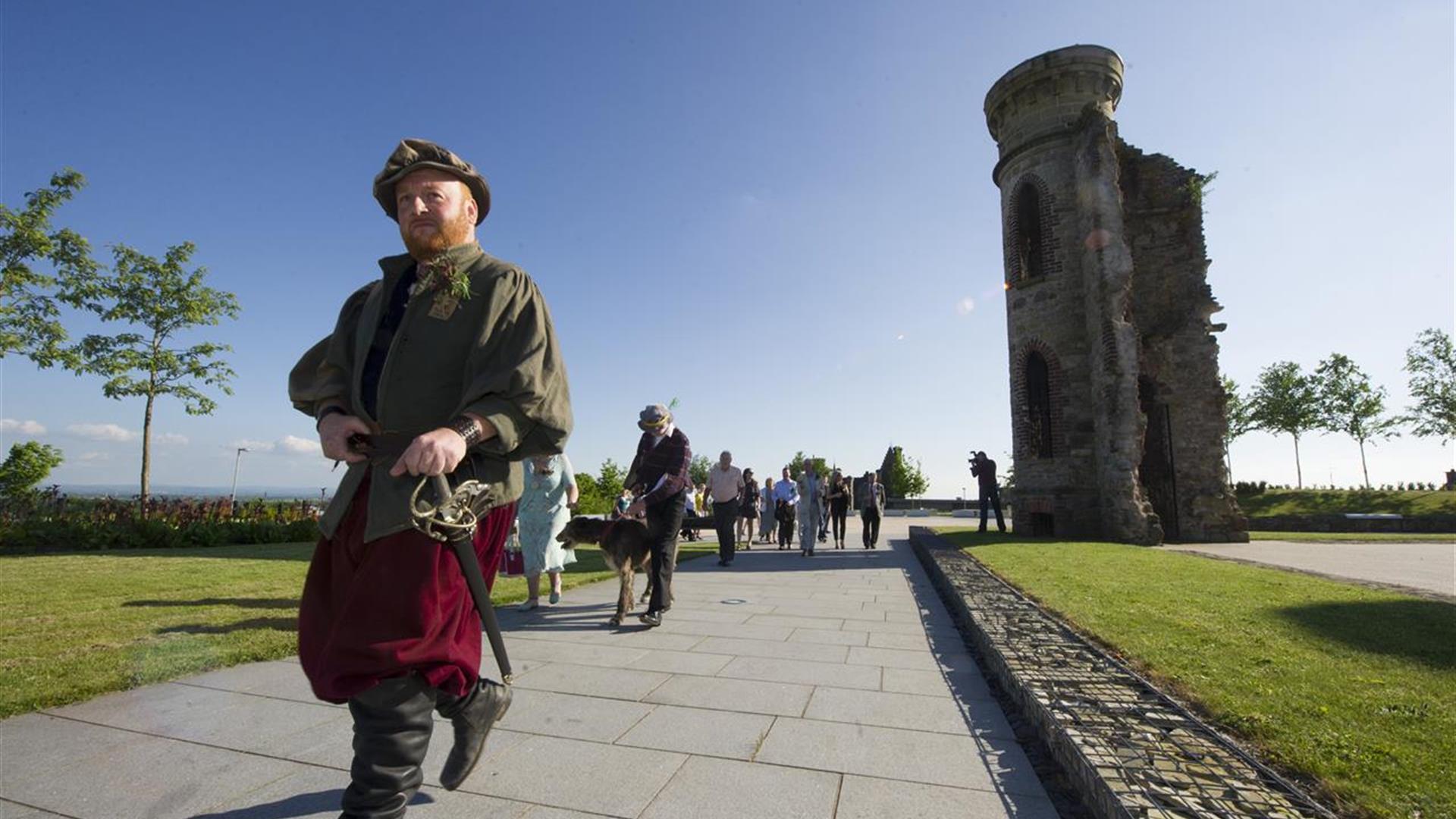 Man dressed in costume leading a group